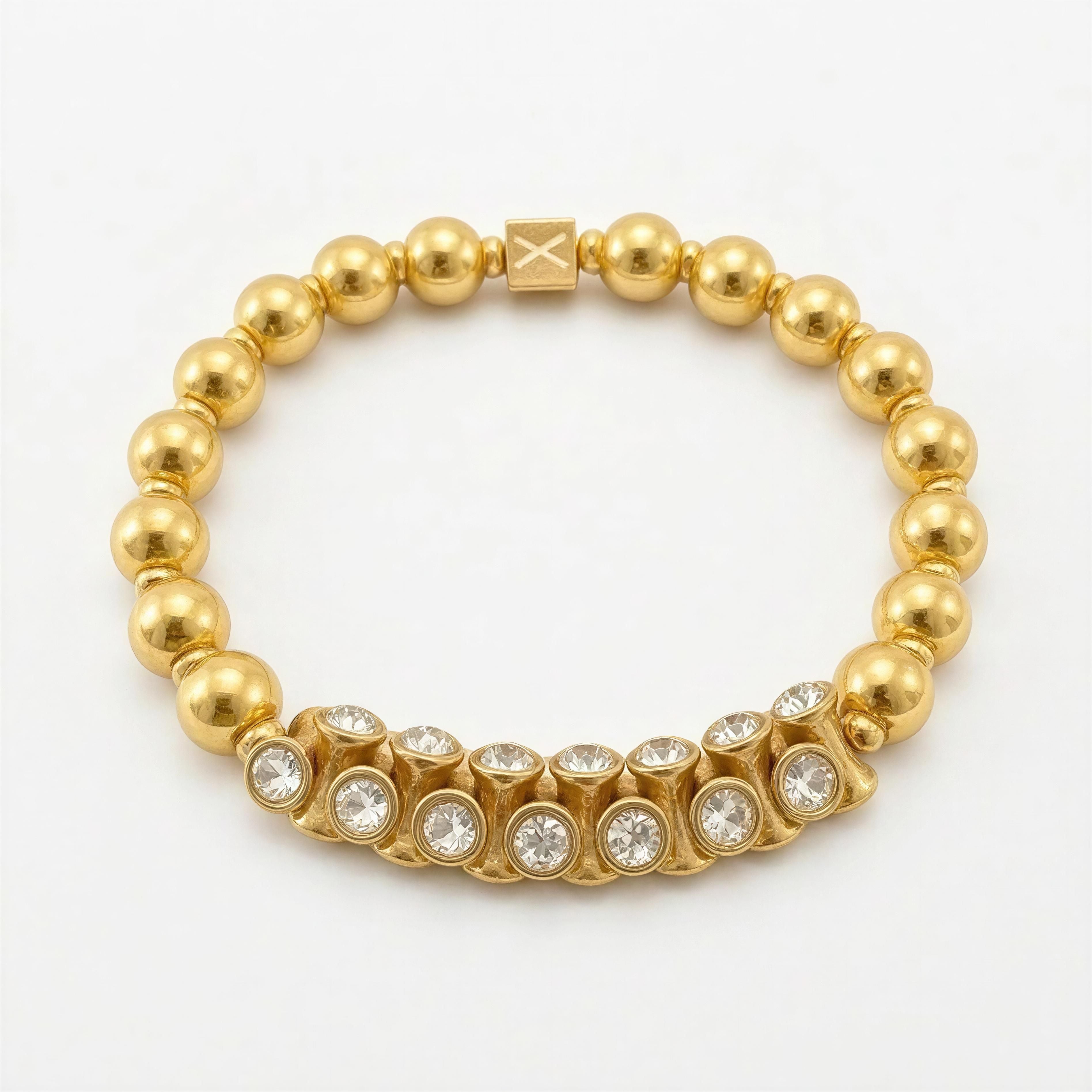 XX ÉLÉGANCE - Golden Éclat features a handcrafted gold beaded bracelet accented with sparkling clear crystals and a signature square charm, radiating luxury and elegance.