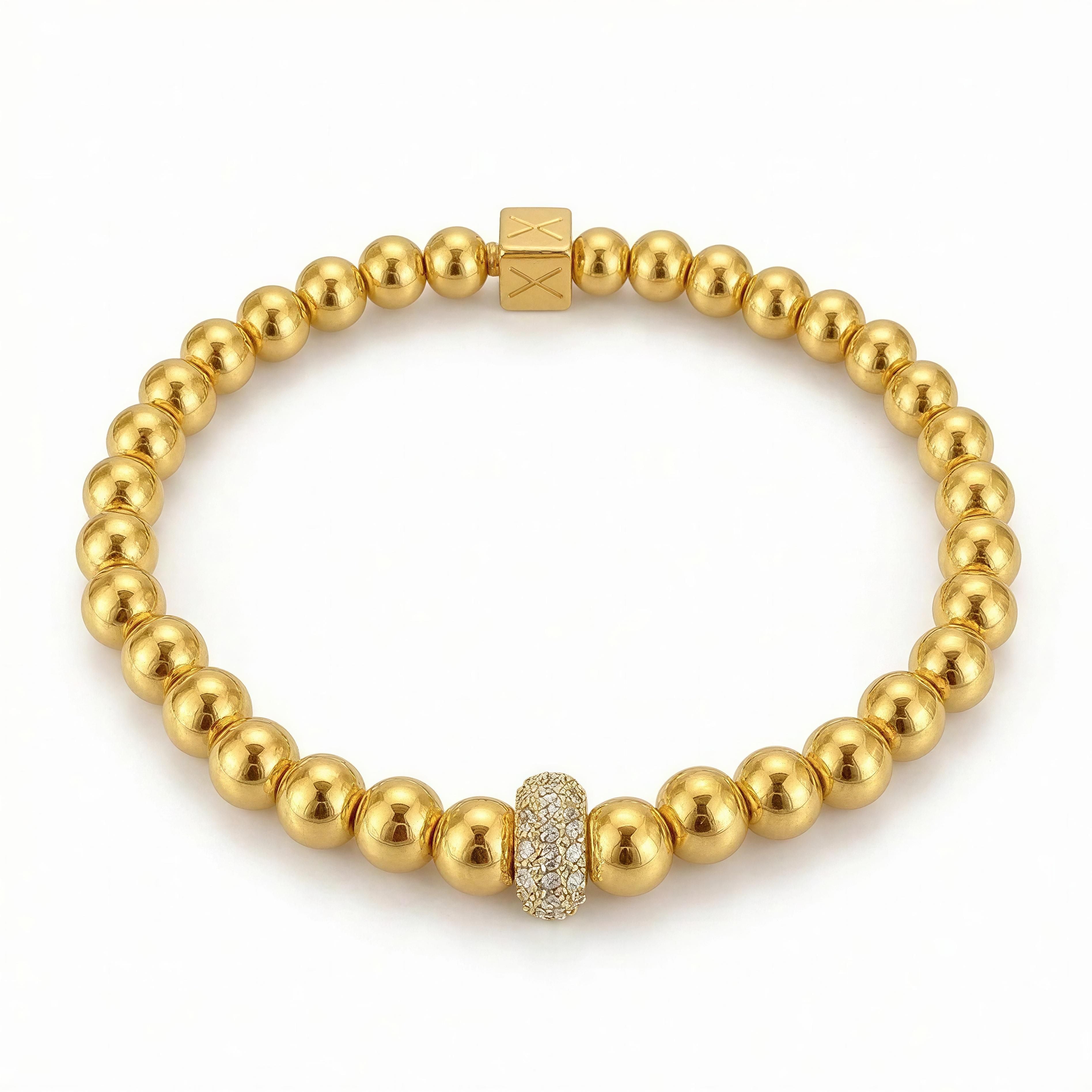 XX ÉLÉGANCE – Champagne Royale bracelet featuring polished gold beads with a sparkling pave bead centerpiece, embodying luxury and handcrafted elegance.