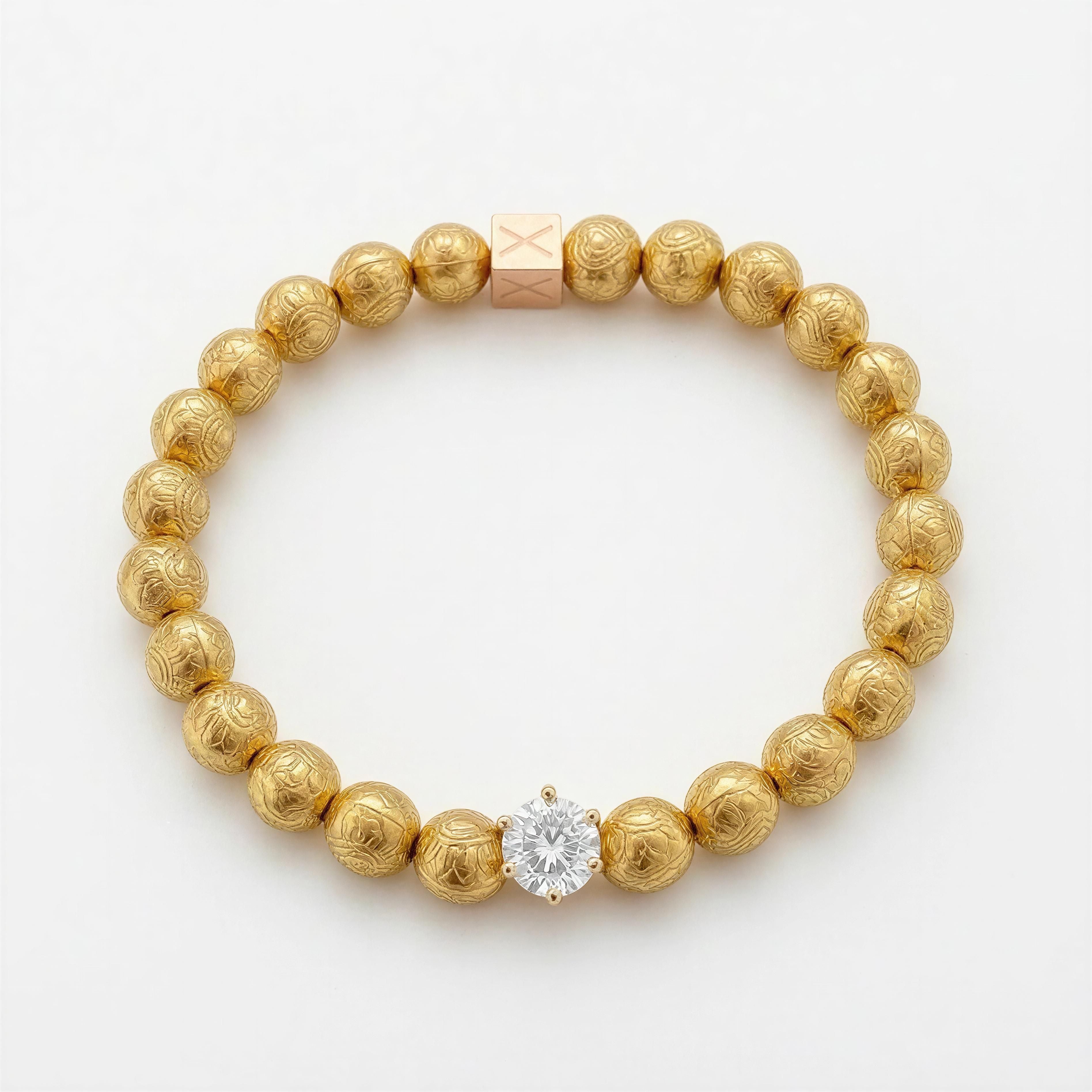 Limited Edition - Textura Aurea Imperia gold beads bracelet featuring intricate textures and a central sparkling gemstone, a luxurious handcrafted designer jewelry piece.