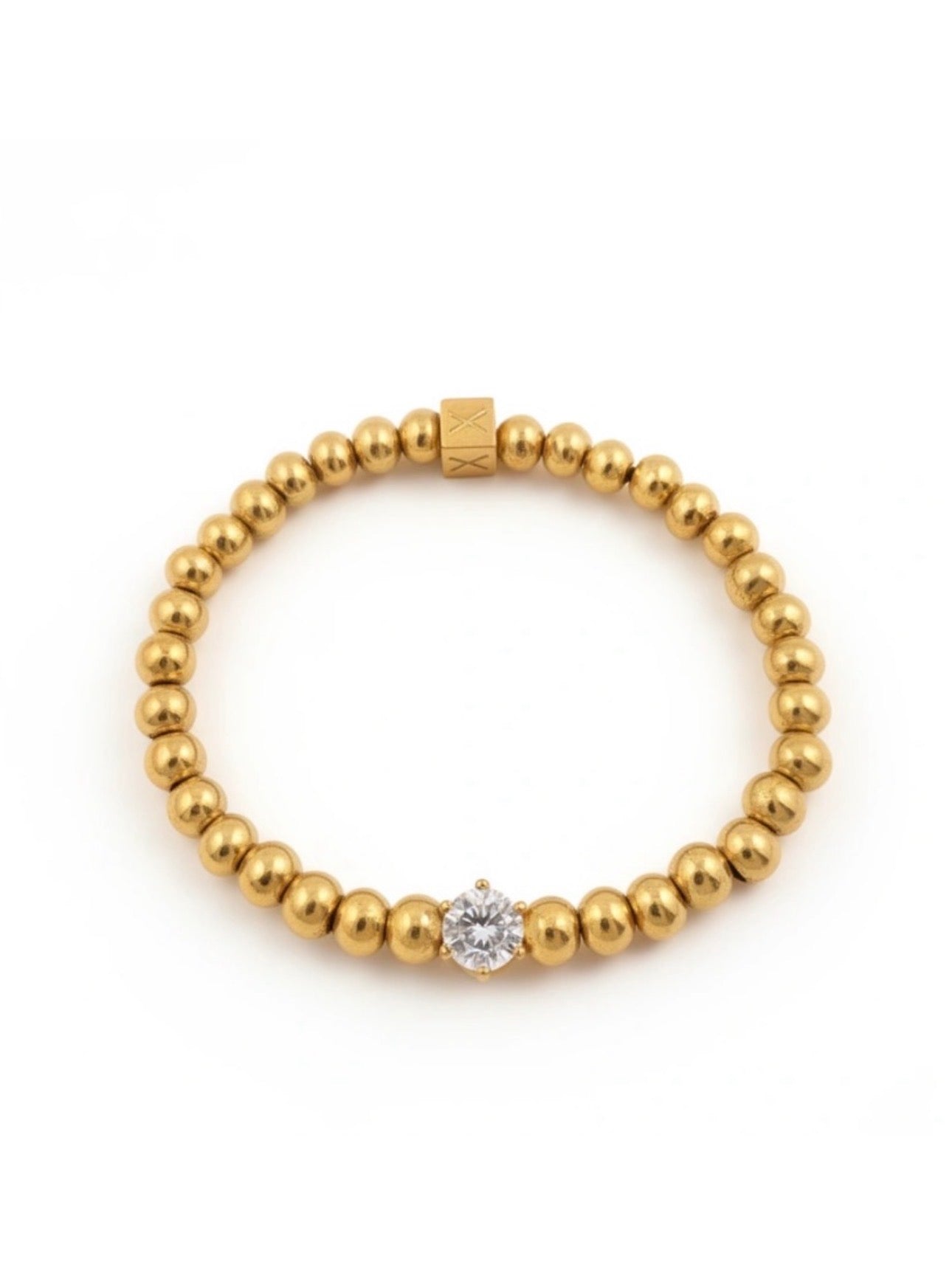 Elegant gold bead bracelet featuring a single sparkling crystal accent, part of The Timeless Collection β Aurea Claritas, showcasing luxury handcrafted jewelry by Atelier X.