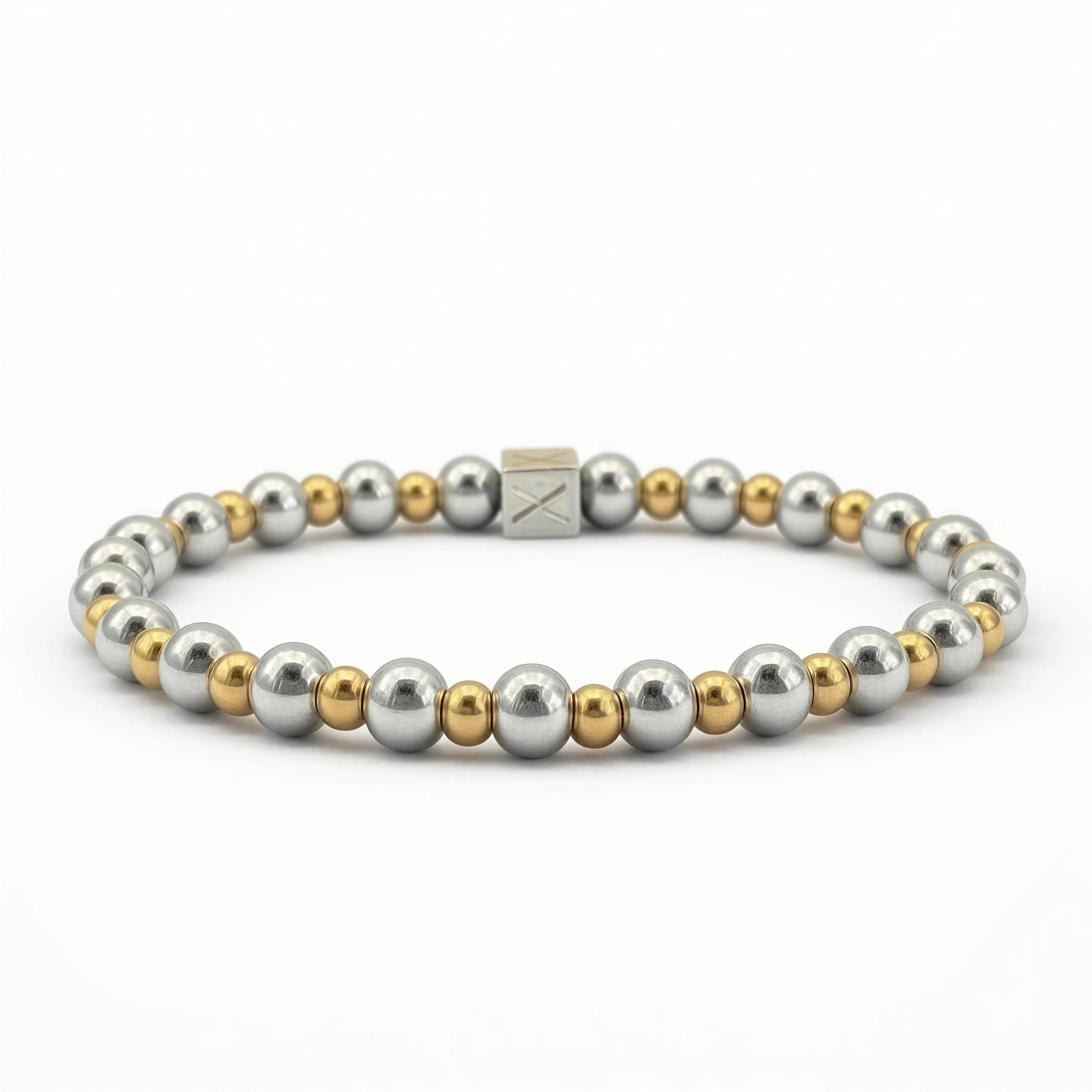 A sleek designer bracelet from The Essential Collection - 6mm & 4mm featuring alternating polished silver and gold beads with a minimalist square clasp, showcasing luxury handcrafted jewelry.