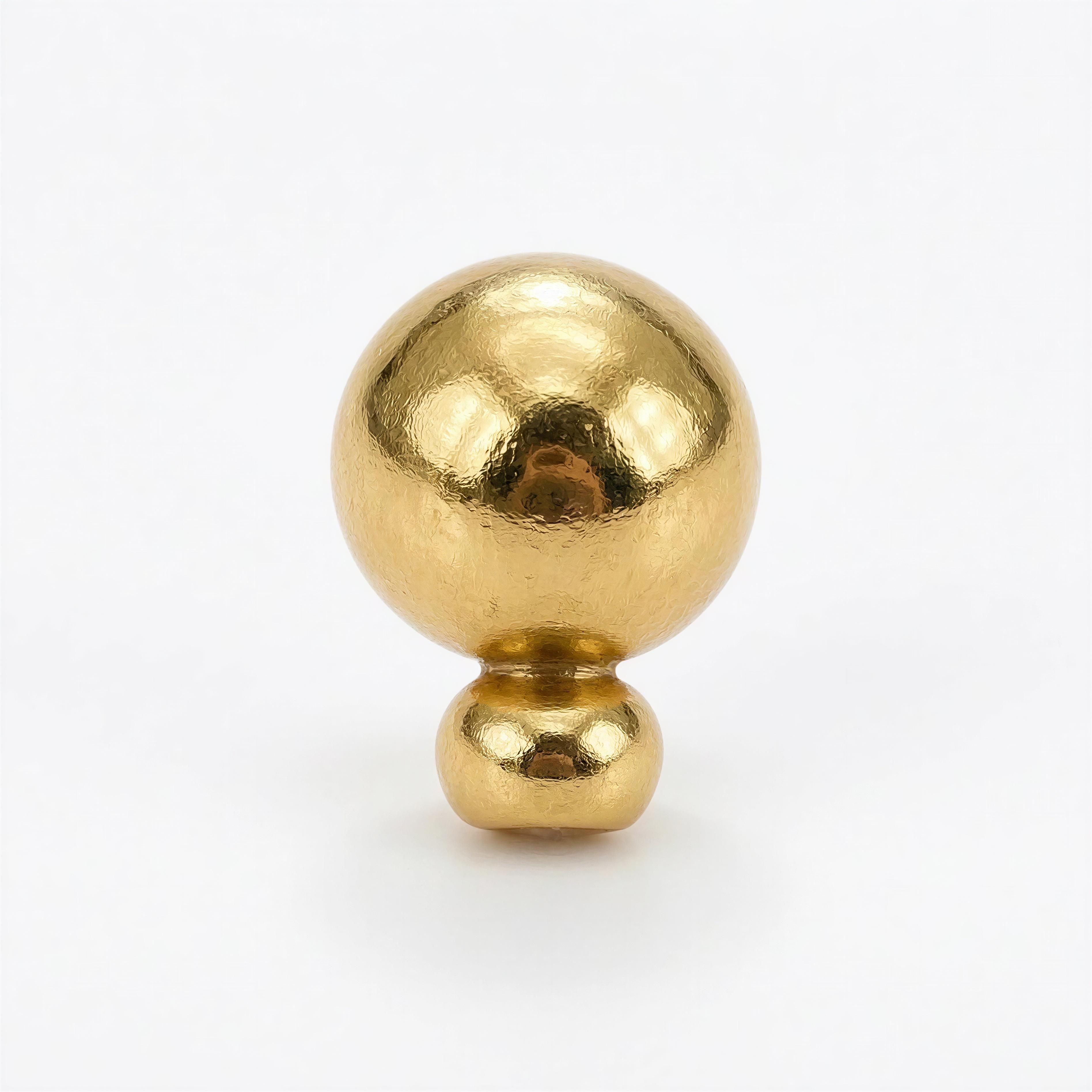 Close-up of two polished gold beads, one larger and one smaller, showcasing the smooth metallic texture and rich golden hue from The Essential Collection - 8mm & 4mm.
