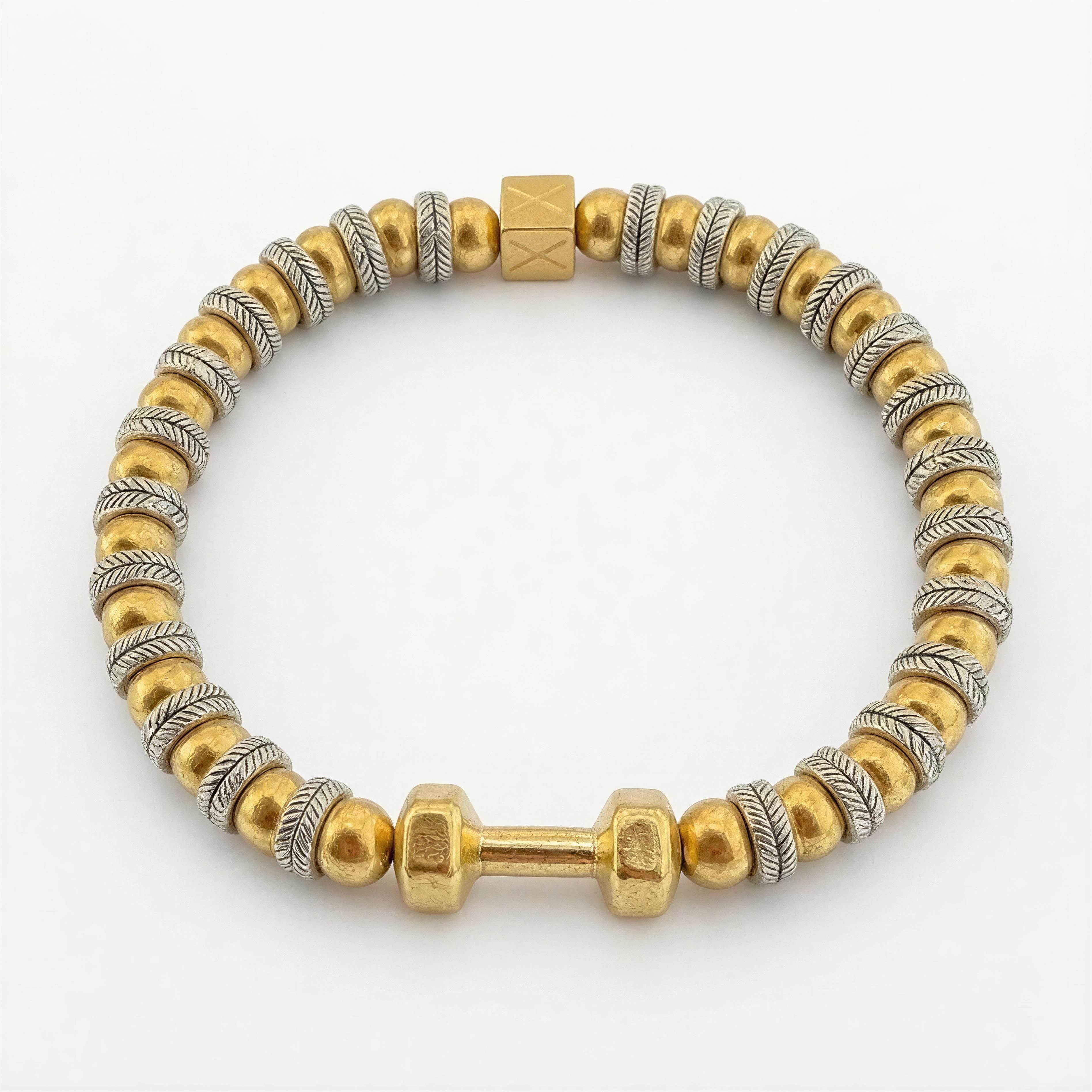 THE X FOR HIM - Driven Balance bracelet featuring gold and silver-toned beads with a dumbbell charm, combining luxury handcrafted design with a bold, masculine edge.