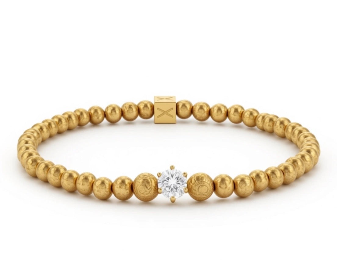 The Solea Collection – Aurea Solea Lux luxury bracelet featuring gold beads with goldleaf detailing and a central sparkling designer crystal, handcrafted by atelier X.