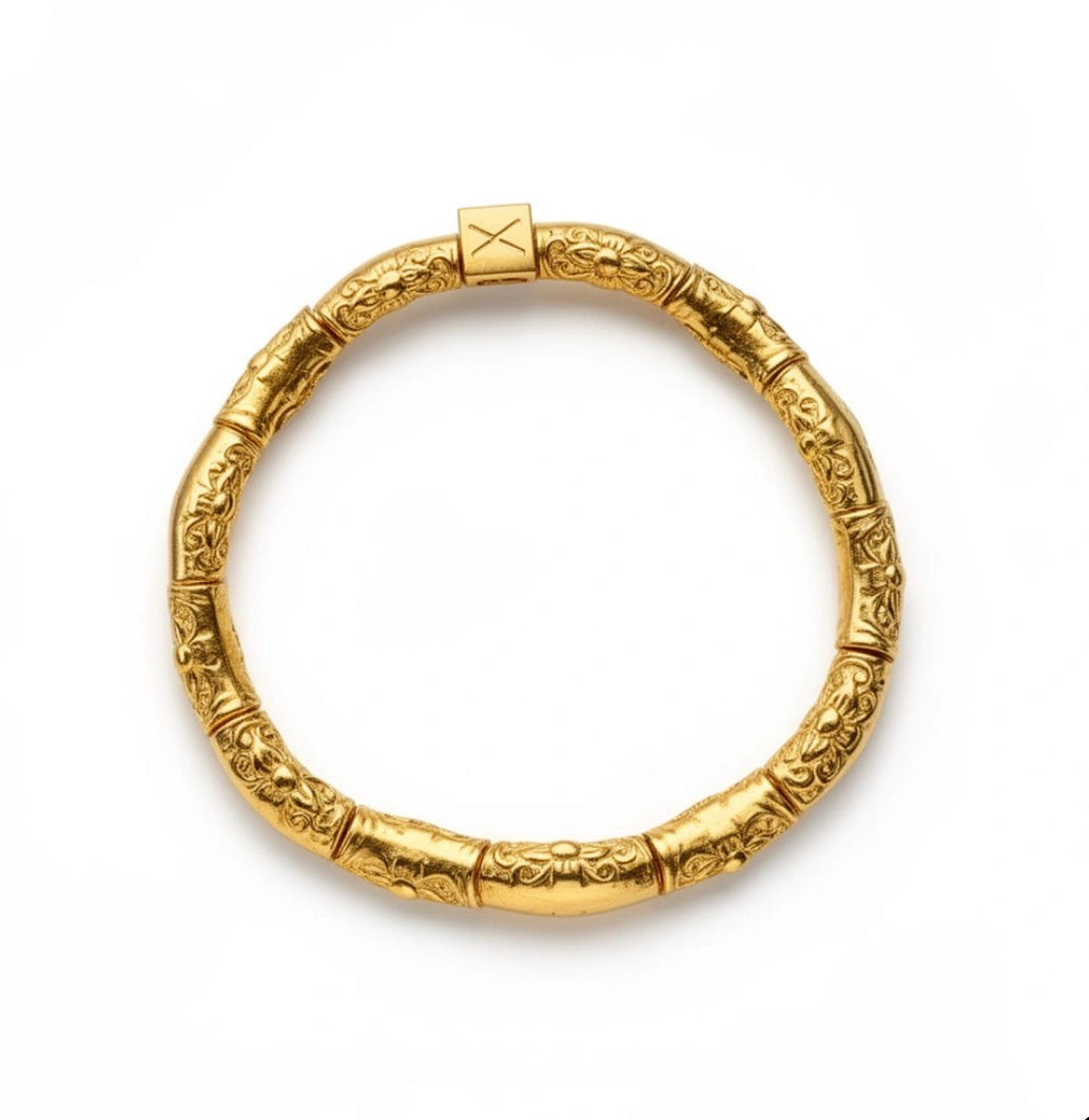 The Essential Collection - Essentia Aurea gold bracelet featuring intricately detailed beads with floral and vine patterns, showcasing handcrafted luxury jewelry by Atelier X.