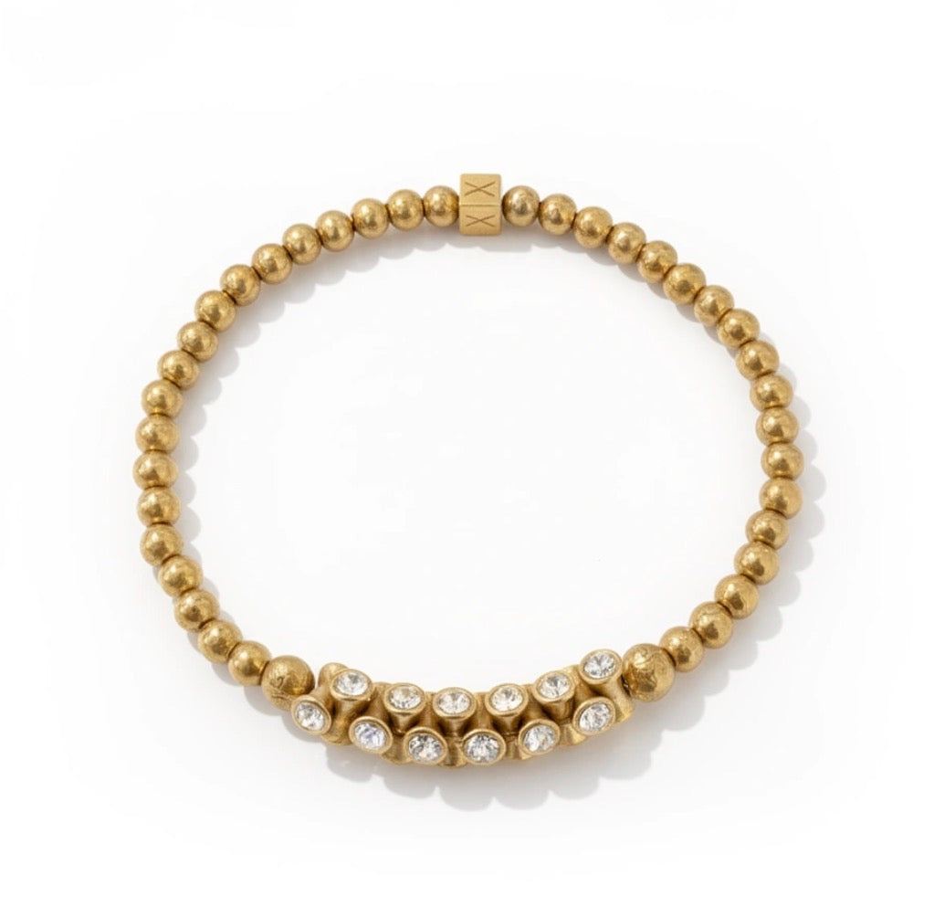 The Solea Collection – Aurea Solea Luminis features a handcrafted luxury bracelet with gold beads and sparkling clear stones, reflecting elegant artisan design by atelierX.