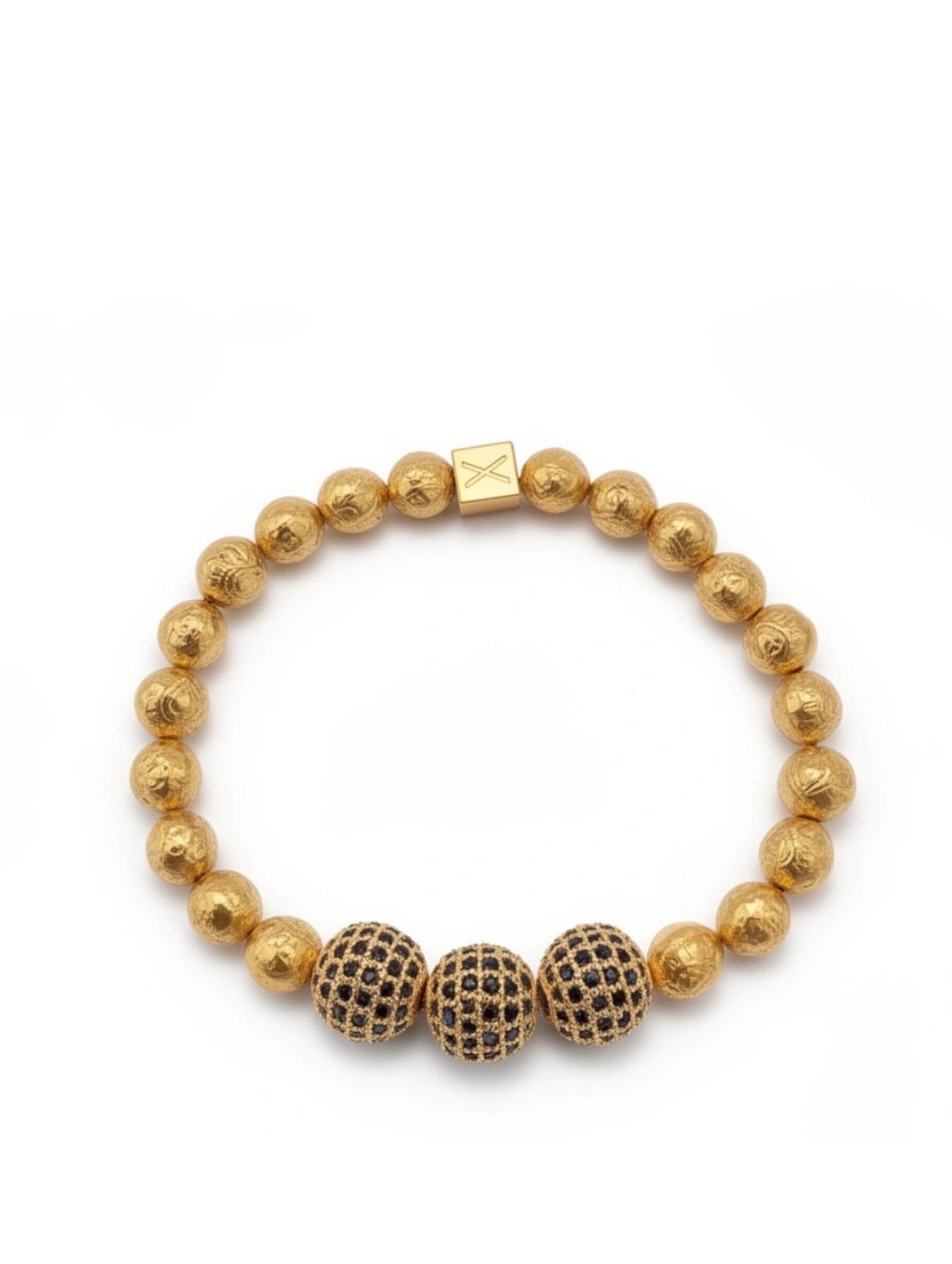 Limited Edition- Aurea Nox Imperium bracelet featuring textured gold beads and three black stone-studded beads, showcasing handcrafted luxury jewelry by atelierX.