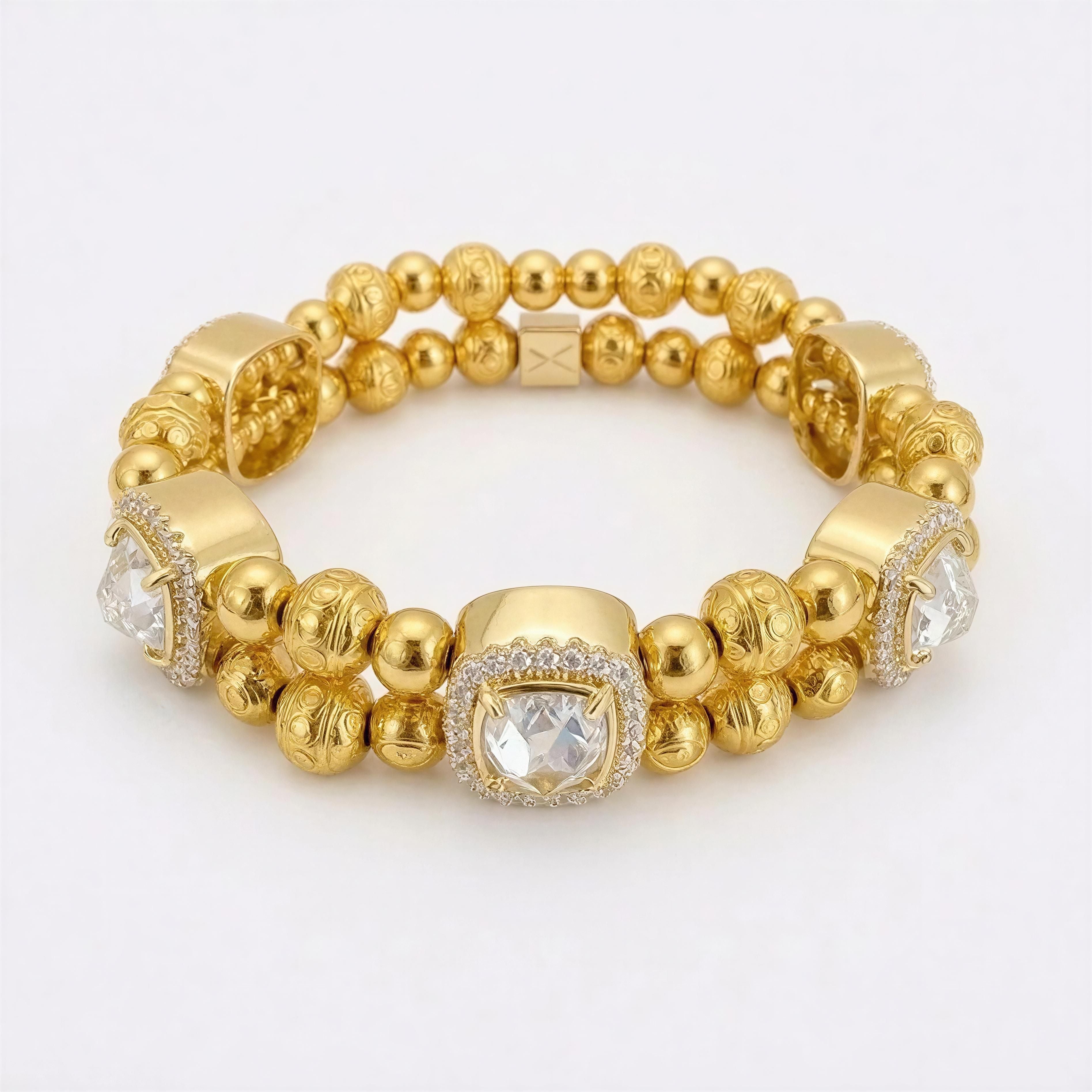 XX ÉLÉGANCE – LIMITED EDITION gold bracelet with intricate textured beads and sparkling clear gemstones, showcasing handcrafted luxury jewelry from Atelier X.