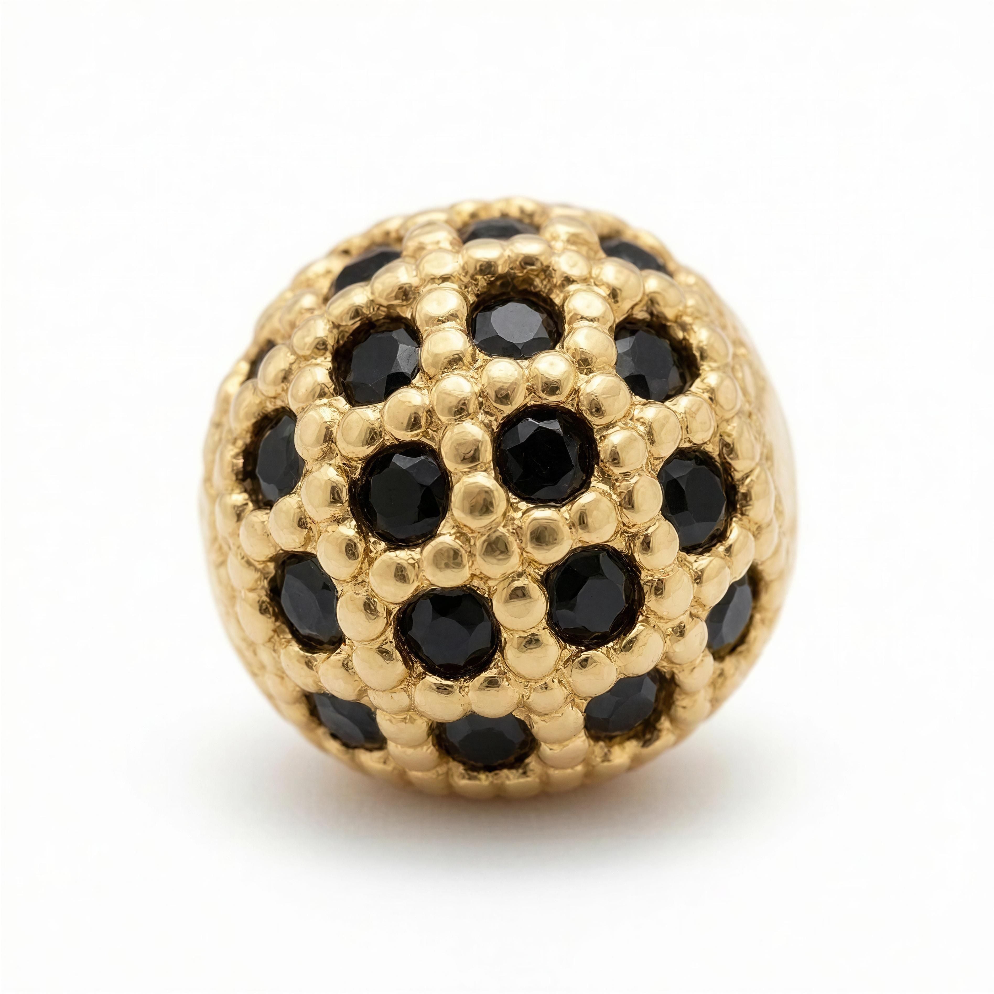 Obsidia Lux features an intricately crafted gold bead adorned with faceted black stones, combining luxury and elegance in a unique designer bracelet element.